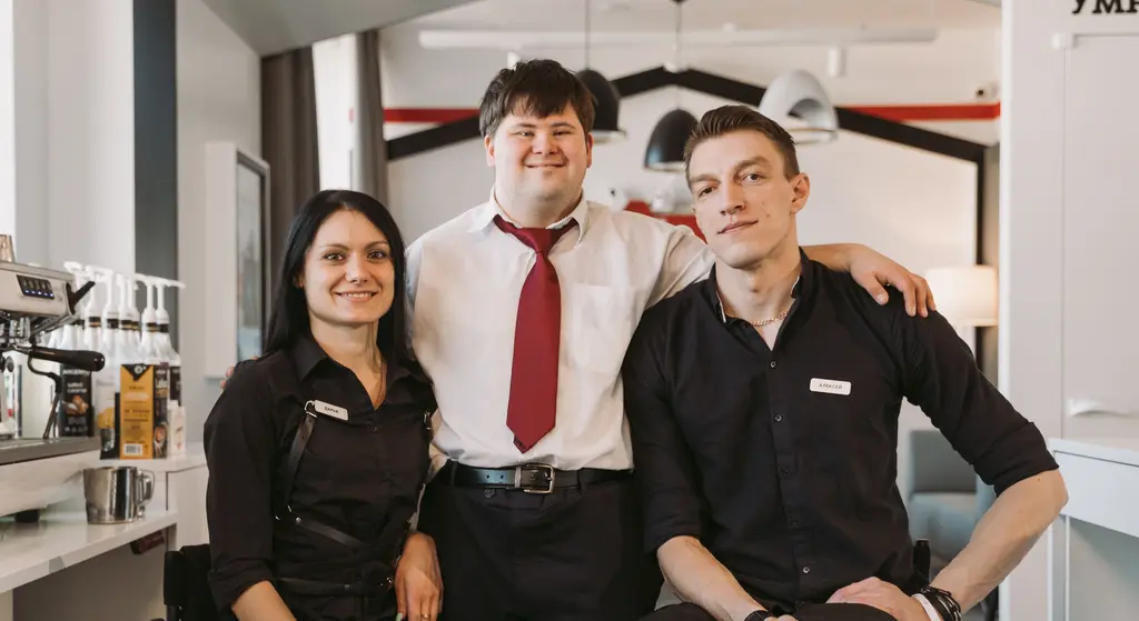 A cafe team including a wheelchair user and a colleague with Down syndrome
