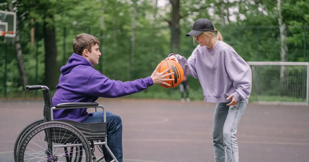 A wheelchair basketball game in a local park